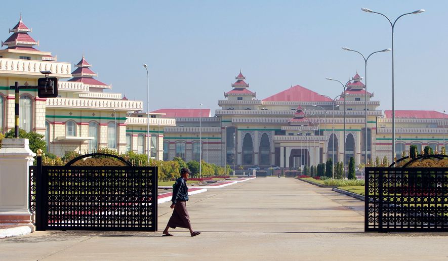 A man walks in front of Parliament Building in Naypyitaw, Myanmar on Jan. 24, 2018. (AP Photo/Aung Shine Oo, File)