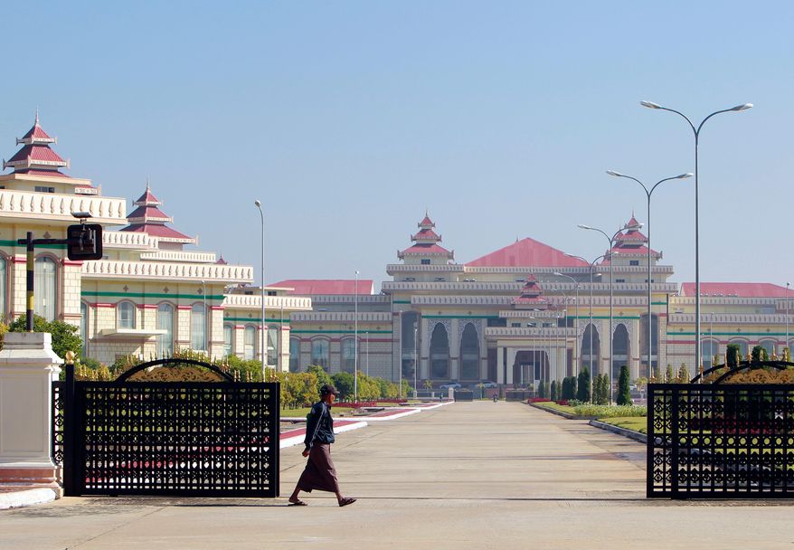 A man walks in front of Parliament Building in Naypyitaw, Myanmar on Jan. 24, 2018. (AP Photo/Aung Shine Oo, File)