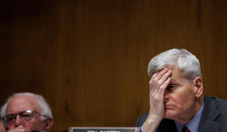 Committee Chair Senator Bill Cassidy R-La. holds his head as Dr. Casey Means testifies during a Senate Health, Education Labor and Pension Committee Conformation Hearing for U.S. Surgeon General on Capitol Hill on Wednesday, Feb. 25, 2026, in Washington. (AP Photo/Tom Brenner)