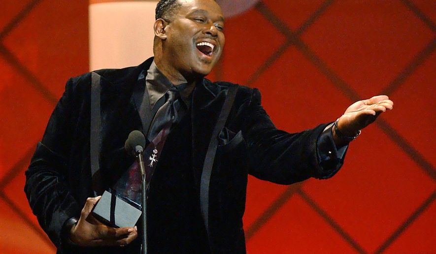 Luther Vandross accepts the award for favorite soul or R&B male artist at the 29th American Music Awards in Los Angeles on Jan. 9, 2002. (AP Photo/Kevork Djansezian, File)