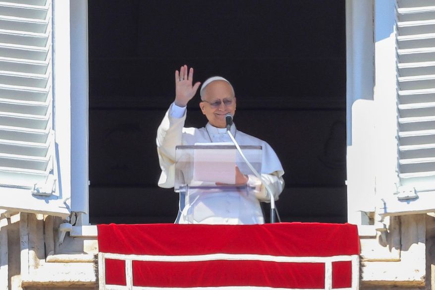 Pope Leo XIV appears at the window of his studio overlooking St. Peter's Square at the Vatican where Catholic faithful and pilgrims gathered for the traditional Sunday blessing at the end of the noon Angelus prayer, Sunday, Feb. 22, 2026. (AP Photo/Riccardo De Luca)