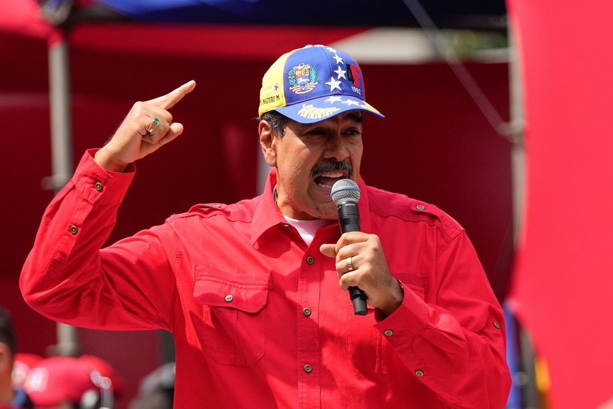File - Venezuela's President Nicolas Maduro speaks to supporters during an event at the Miraflores Presidential palace in Caracas, Venezuela, Feb. 4, 2024. (AP Photo/Matias Delacroix,File)