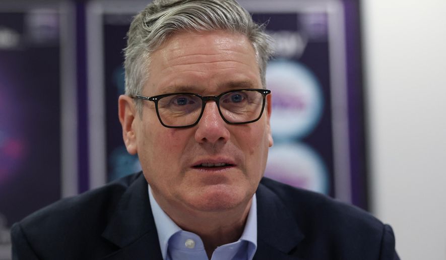 British Prime Minister Sir Keir Starmer speaks with students and staff, during a visit to the Walbottle Academy Campus in Newcastle-upon-Tyne, England, Thursday, Feb. 26, 2026. (Scott Heppell/PA via AP)