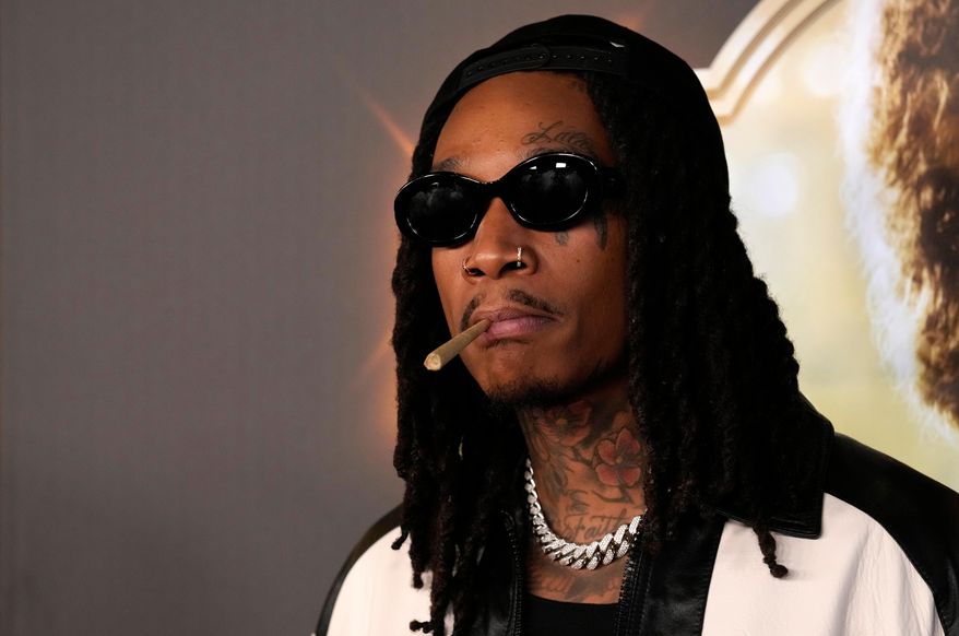 American rapper Wiz Khalifa poses for a photo at the "Spinning Gold" file premiere at the Directors Guild of America in Los Angeles, March 29, 2023. (AP Photo/Chris Pizzello, File)