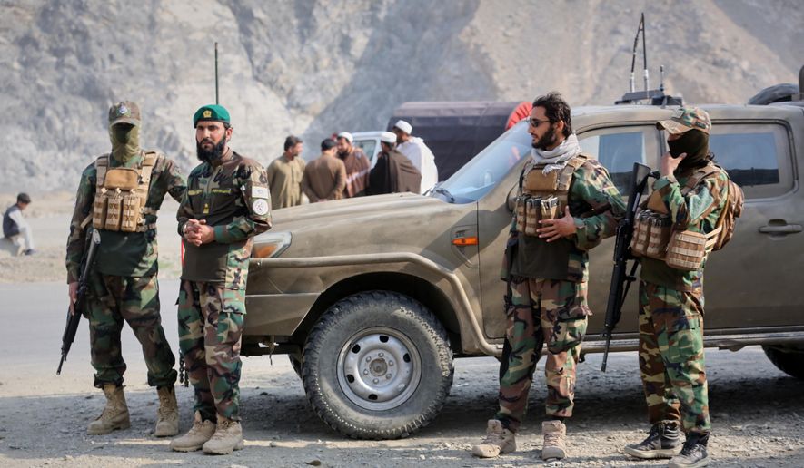 Afghan Taliban soldiers gather on the Afghan side of the Torkham border crossing with Pakistan in Torkham, Afghanistan, Friday, Feb. 27, 2026. (AP Photo/Wahidullah Kakar) ** FILE **