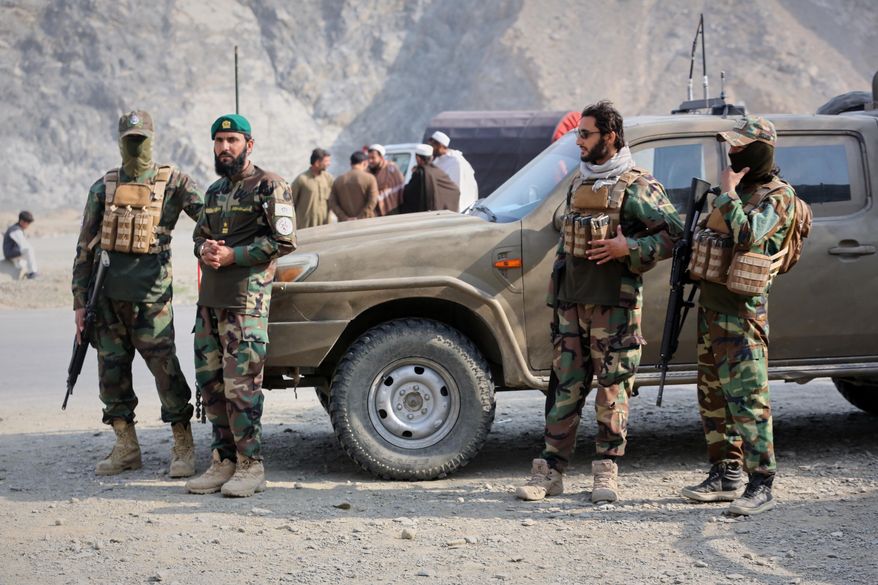 Afghan Taliban soldiers gather on the Afghan side of the Torkham border crossing with Pakistan in Torkham, Afghanistan, Friday, Feb. 27, 2026. (AP Photo/Wahidullah Kakar) ** FILE **