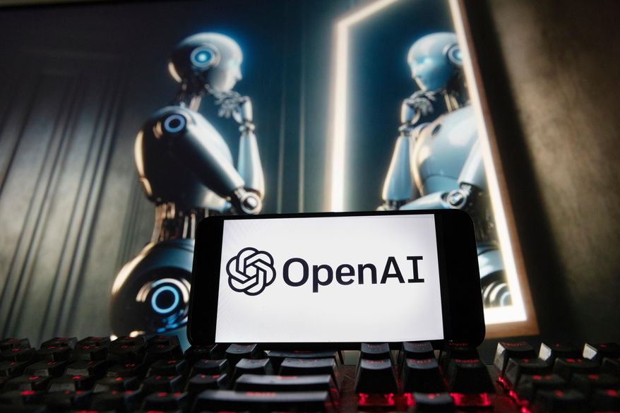 The OpenAI logo is displayed on a cellphone with an image on a computer monitor generated by ChatGPT's Dall-E text-to-image model, Dec. 8, 2023, in Boston. (AP Photo/Michael Dwyer, File)