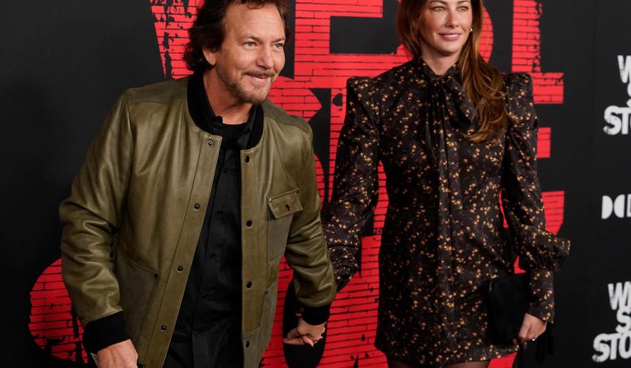 Pearl Jam singer Eddie Vedder, left, and his wife Jill McCormick appear at the premiere of the film "West Side Story," in Los Angeles on Dec. 7, 2021. (AP Photo/Chris Pizzello, File)