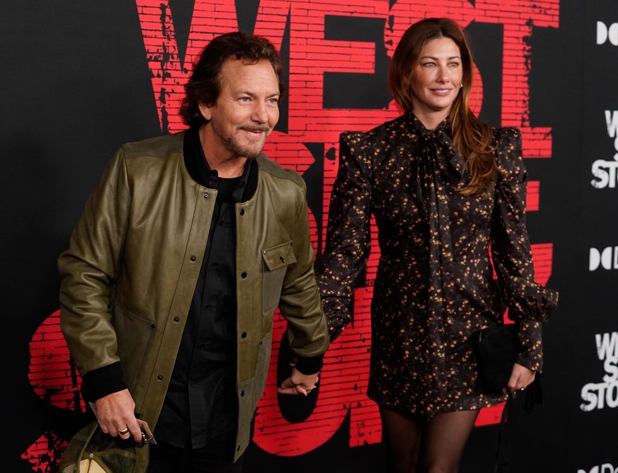 Pearl Jam singer Eddie Vedder, left, and his wife Jill McCormick appear at the premiere of the film "West Side Story," in Los Angeles on Dec. 7, 2021. (AP Photo/Chris Pizzello, File)