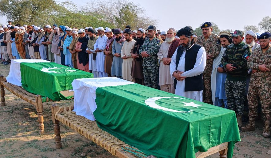 People offer funeral prayers for paramilitary soldiers killed during a gunbattle with militants in the Waziristan area, on the outskirts of Kohat, Pakistan, Friday, Feb. 27, 2026. (AP Photo/S.B. Shah)