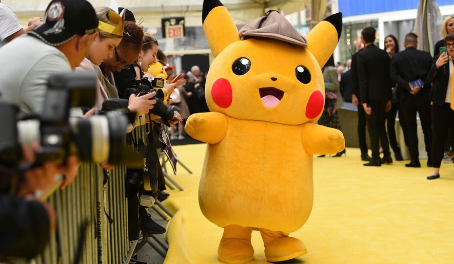 A person in a Pikachu character costume attends the premiere of "Pokemon Detective Pikachu" at Military Island in Times Square, May 2, 2019, in New York. (Photo by Evan Agostini/Invision/AP, File)
