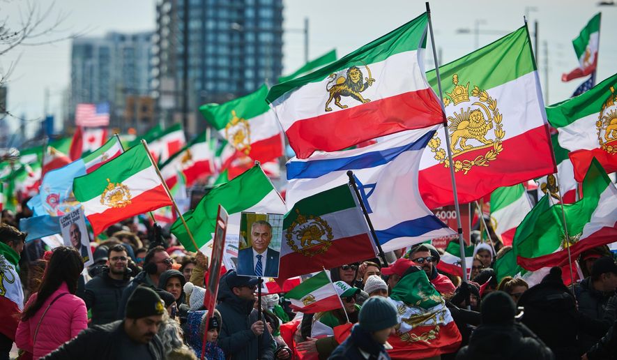 Protesters march in support of regime change in Iran during a demonstration in Richmond Hill, Ont., Saturday, Feb. 28, 2026. (Sammy Kogan/The Canadian Press via AP)