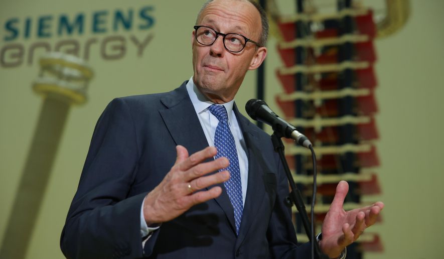 German Chancellor Friedrich Merz speaks before media members as he visits facilities of Siemens Energy during his official visit, in Hangzhou, China, Thursday, Feb. 26, 2026. (Andres Martinez Casares/Pool Photo via AP)