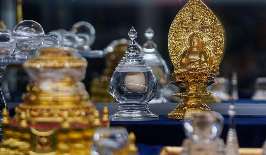 Buddhist relics, including shariras and bones believed to be those of the Buddha, are displayed at Wei Mountain Temple, in Rosemead, Calif., Saturday, Feb. 17, 2024. (AP Photo/Damian Dovarganes)
