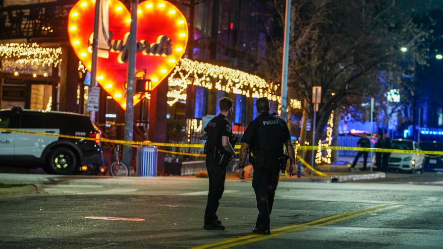 Police officers guard the scene on West 6th Street at West Avenue after a shooting, Sunday March 1, 2026, in Austin, Texas. (Ricardo B. Brazziell/Austin American-Statesman via AP)