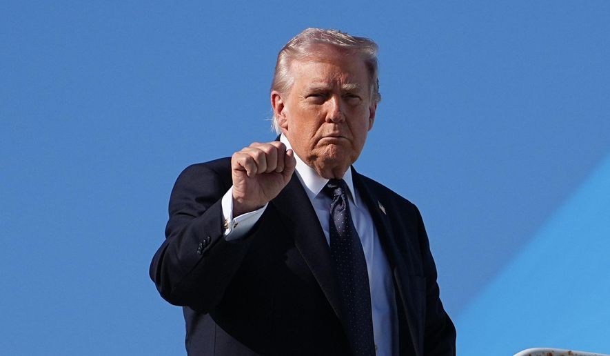 President Donald Trump gestures as he boards Air Force One at Palm Beach International Airport, Sunday, March 1, 2026, in West Palm Beach, Fla. (AP Photo/Matt Rourke)