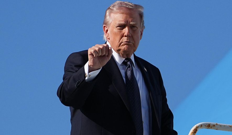 President Donald Trump gestures as he boards Air Force One at Palm Beach International Airport, Sunday, March 1, 2026, in West Palm Beach, Fla. (AP Photo/Matt Rourke)
