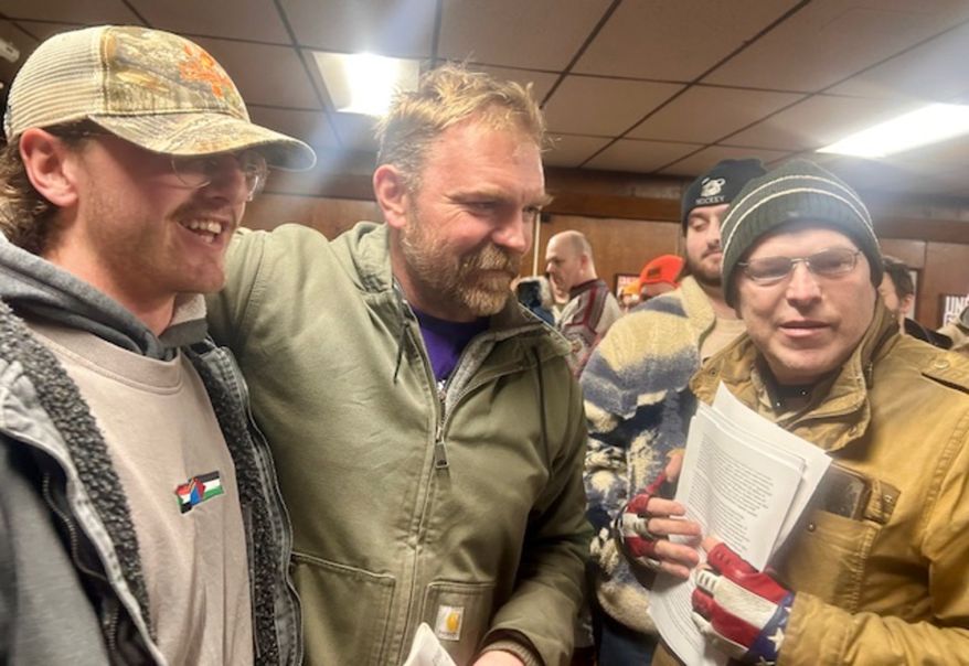 Democratic Senate candidate Graham Platner (center) at a campaign event in Maine. (Seth McLaughlin/The Washington Times)