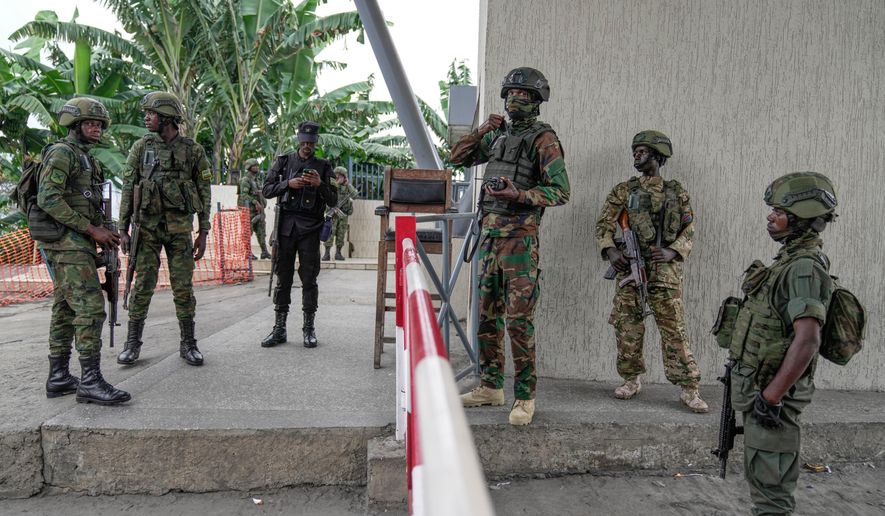 FILE - M23 rebels negotiate with Rwanda Army to release captured Romanian mercenaries to Rwanda Government, who were fighting alongside Democratic Republic of Congo army (FRDC), at Gisenyi border point in Congo, Jan. 29, 2025, after the M23 rebels advanced into eastern Congo's capital Goma. (AP Photo/Brian Inganga, file)