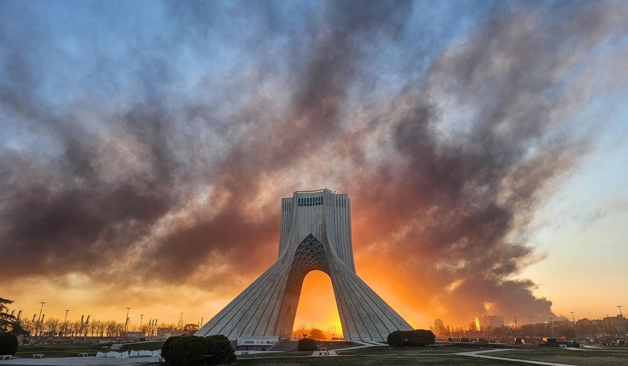 Smoke rises up behind Azadi, or freedom tower, following a U.S.-Israeli military strike in Tehran, Iran, Tuesday, March 3, 2026. ((Davoud Ghahrdar/ISNA via AP)
