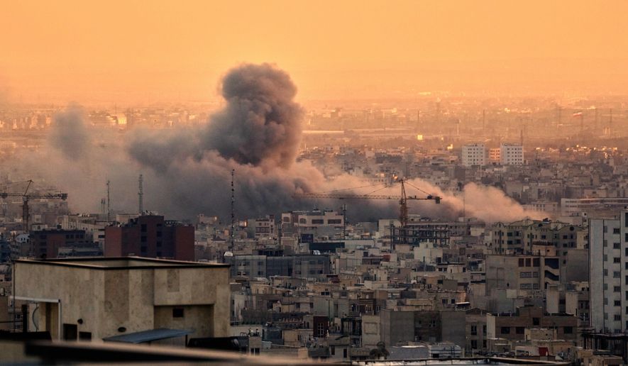 A plume of smoke rises following a U.S.-Israeli military strike in Tehran, Iran, Tuesday, March 3, 2026. (AP Photo/Vahid Salemi)