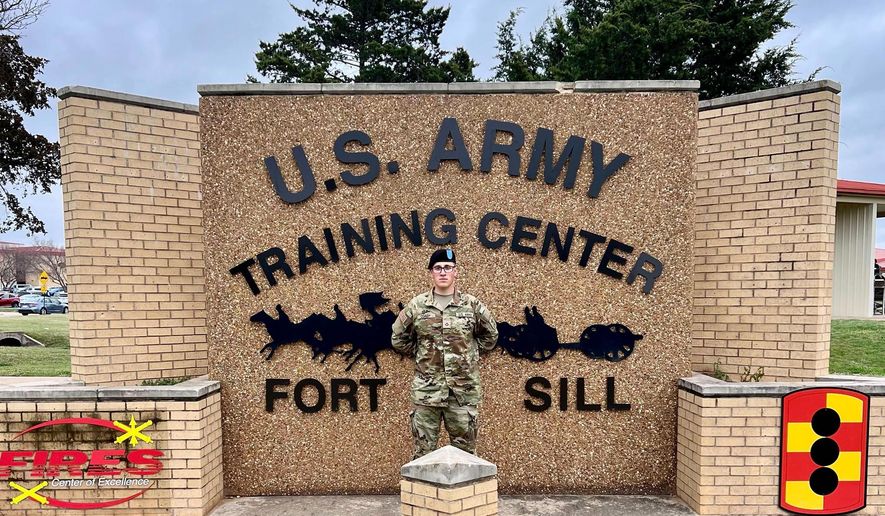 This photo provided by Andrew Coady shows his son, Declan Coady, posing for a photo on the day of his graduation at U.S. Army Training Center at Fort Sill, Okla., March 15, 2024. (Andrew Coady via AP)