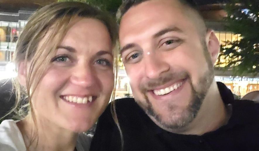 This undated photo provided by Joey Amor shows Nicole Amor, left, and Joey Amor smiling for a photo. (Joey Amor via AP)