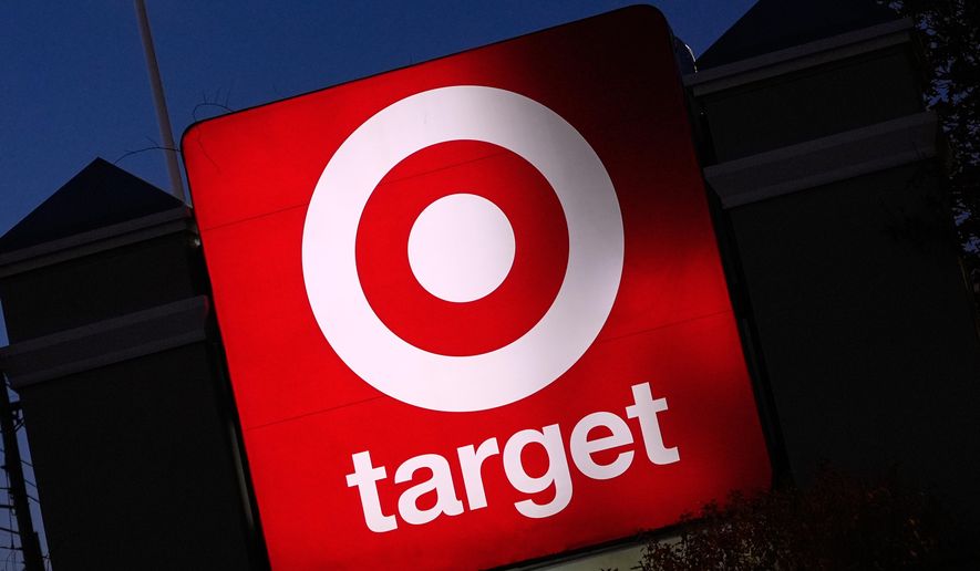 The Target logo displayed on a sign outside a store, Nov. 18, 2025, in Salem, N.H. (AP Photo/Charles Krupa, File)