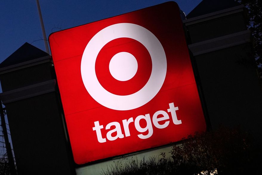 The Target logo displayed on a sign outside a store, Nov. 18, 2025, in Salem, N.H. (AP Photo/Charles Krupa, File)