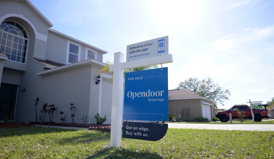FILE - Real estate signs are posted outside homes for sale, Feb. 21, 2023, in Valrico, Fla. (AP Photo/Phelan M. Ebenhack, File)
