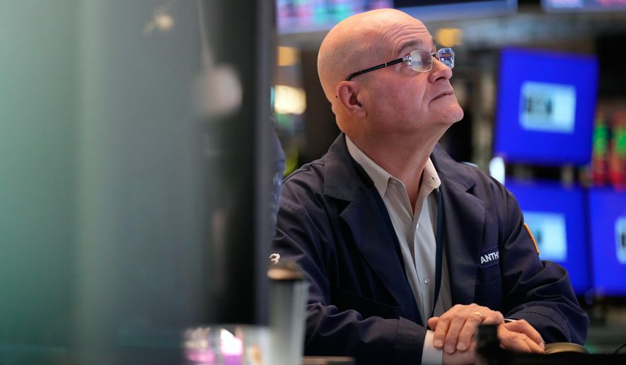 Anthony Confusione works on the floor at the New York Stock Exchange in New York, Tuesday, March 3, 2026. (AP Photo/Seth Wenig)