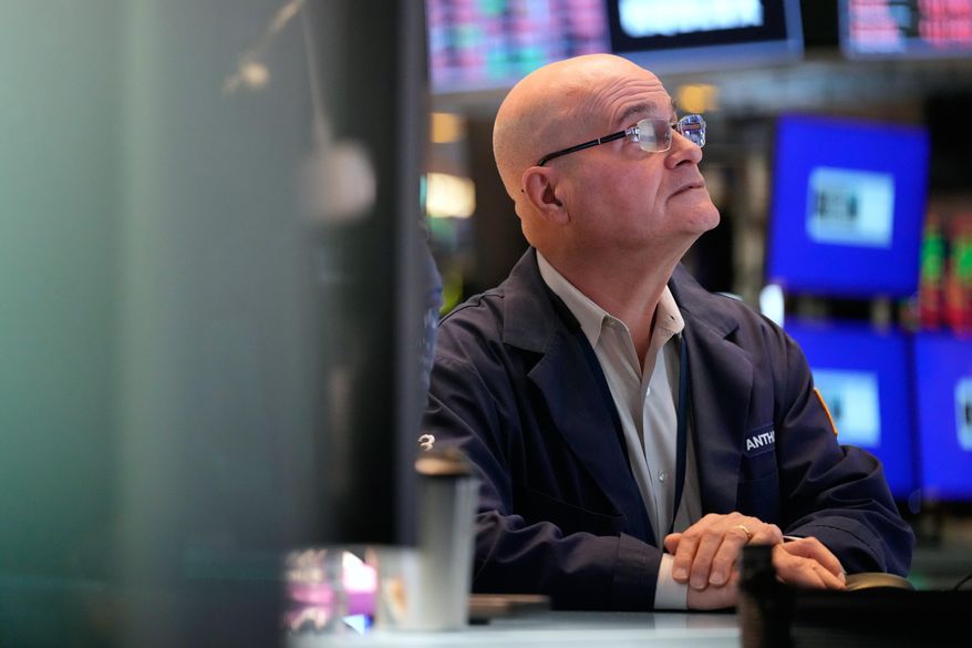 Anthony Confusione works on the floor at the New York Stock Exchange in New York, Tuesday, March 3, 2026. (AP Photo/Seth Wenig)
