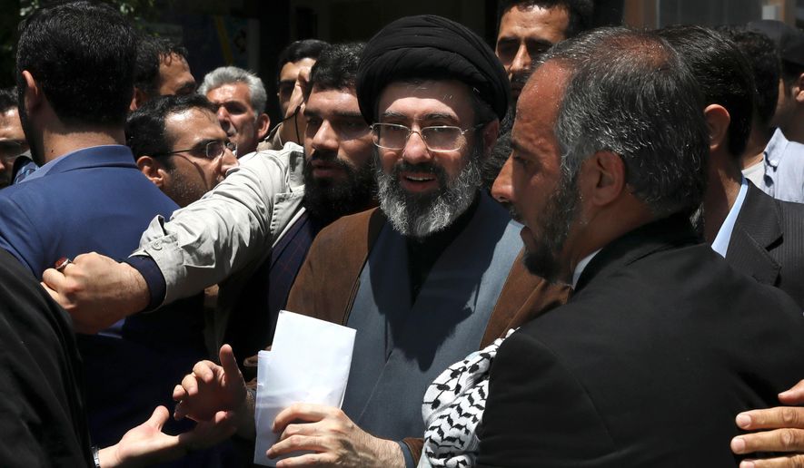 Mojtaba Khamenei, the son of Iranian Supreme Leader Ayatollah Ali Khamenei, center, attends the annual Quds, or Jerusalem Day rally in Tehran, Iran, on May 31, 2019. (AP Photo/Vahid Salemi, File)