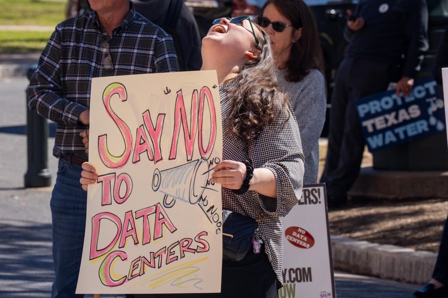 Christina Speasmaker of Waco yells a chant as advocacy groups and community members protest laws surrounding data centers while outside the Texas Capitol, in Austi, Texas, Monday, Feb. 23, 2026. (Mikala Compton/Austin American-Statesman via AP)