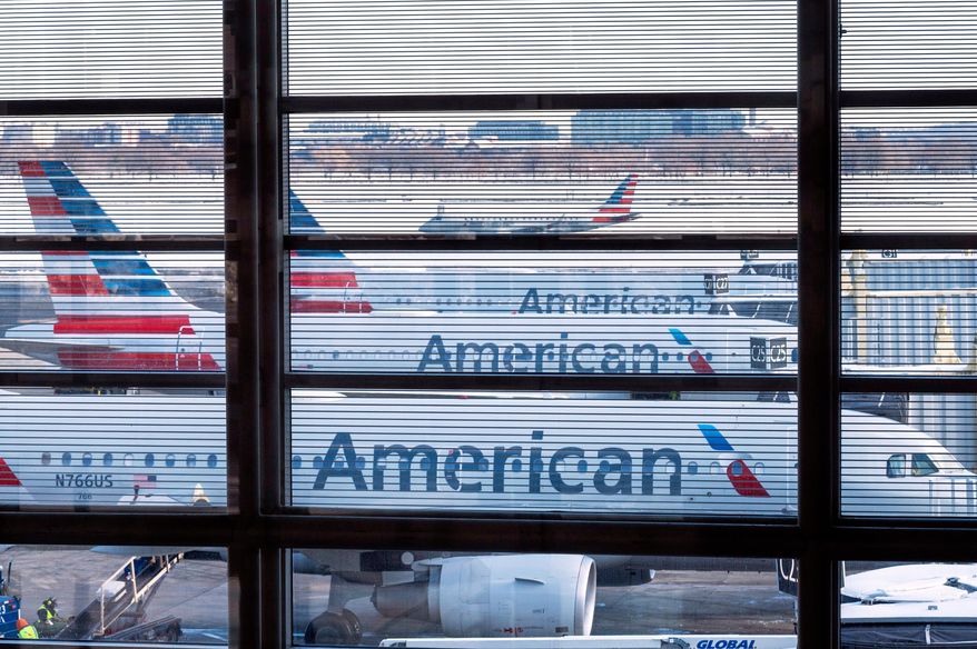 American Airlines passenger planes are seen at gates at Ronald Reagan Washington National Airport in Arlington, Va., on Jan. 29, 2026. (AP Photo/Cliff Owen) **FILE**