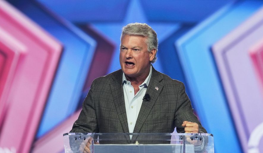 Rep. Mike Collins, R-Ga., speaks during Turning Point USA's AmericaFest 2025 on Dec. 20, 2025, in Phoenix. (AP Photo/Ross D. Franklin, File)
