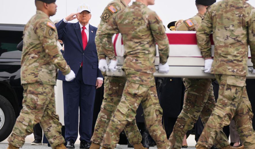 An Army carry team moves a flag-draped transfer case with the remains of U.S. Army Reserve soldier Sgt. 1st Class Nicole Amor, of White Bear Lake, Minn., who was killed in a drone strike at a command center in Kuwait after the U.S. and Israel launched its military campaign against Iran, past President Donald Trump during a casualty return, Saturday, March 7, 2026, at Dover Air Force Base, Del. (AP Photo/Mark Schiefelbein)