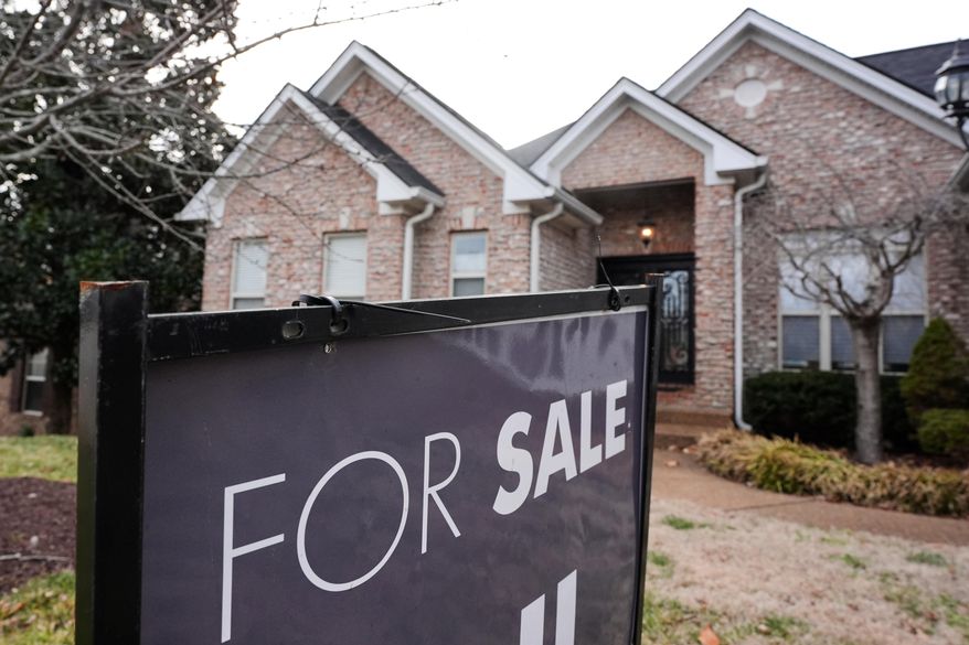 A "for sale" sign is posted outside a home in Nashville, Tenn., on Tuesday, Feb. 10, 2026. (AP Photo/George Walker IV)