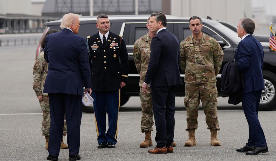 President Donald Trump steps off Air Force One with Defense Secretary Pete Hegseth, Saturday, March 7, 2026, at Dover Air Force Base, Del. (AP Photo/Mark Schiefelbein)