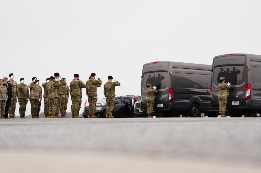 An Army carry team salute transfer vans with the remains of U.S. Army Reserve soldiers Maj. Jeffrey O'Brien, 45, of Indianola, Iowa, Capt. Cody Khork, 35, of Winter Haven, Florida, Chief Warrant Officer 3 Robert Marzan, 54, of Sacramento, Sgt. 1st Class Nicole Amor, 39, of White Bear Lake, Minnesot, Sgt. 1st Class Noah Tietjens, 42, of Bellevue, Nebraska and Sgt. Declan Coady, 20, of West Des Moines, Iowa, who was killed in a drone strike at a command center in Kuwait after the U.S. and Israel launched its military campaign against Iran, during a casualty return, Saturday, March 7, 2026, at Dover Air Force Base, Del. (AP Photo/Julia Demaree Nikhinson)