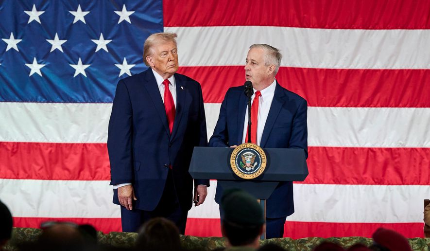 President Donald Trump watches while Republican Senate candidate Michael Whatley speaks to the troops in Fort Bragg, N.C., Friday, Feb. 13, 2026. (AP Photo/Matt Ramey)