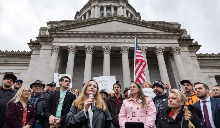 Political podcast host Brandi Kruse, foreground, speaks during a rally to urge Democratic lawmakers to hold hearings to consider GOP initiatives Jan. 31, 2024 in Olympia, Wash. (Ken Lambert/The Seattle Times via AP, File)
