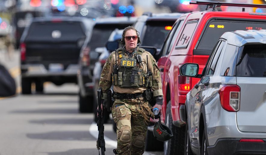 Law enforcement respond to a call at Temple Israel synagogue Thursday, March 12, 2026, in West Bloomfield Township, Mich. (AP Photo/Paul Sancya)