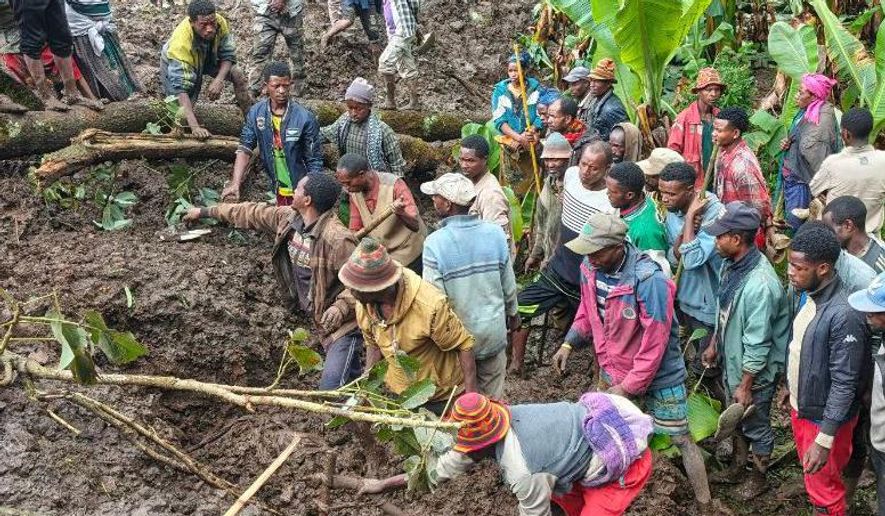 Locals search for the bodies of mudslide victims in the Gacho Baba district of the Gamo Zone in southern Ethiopia on Tuesday, March 10, 2026. (Gacho Baba District Government Communication Affairs Department via AP)