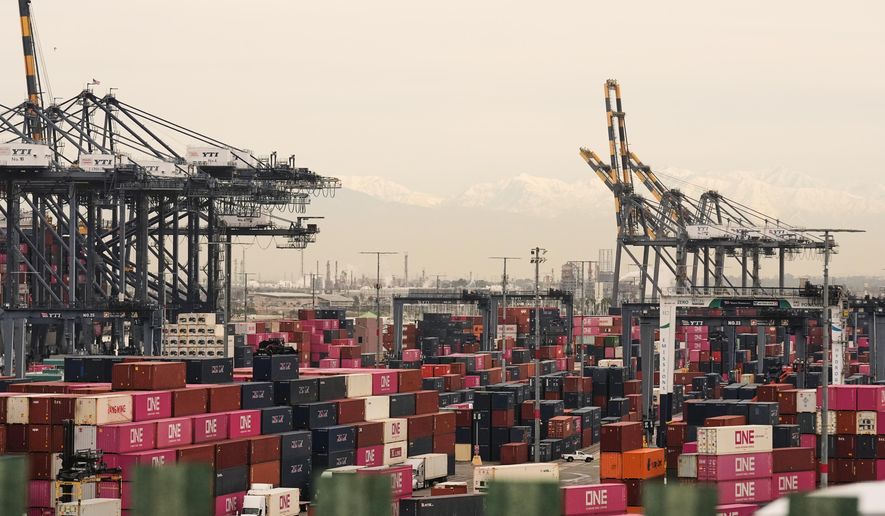 Containers are stacked at the Port of Los Angeles on Friday, Feb. 20, 2026, in Los Angeles. (AP Photo/Damian Dovarganes, File)
