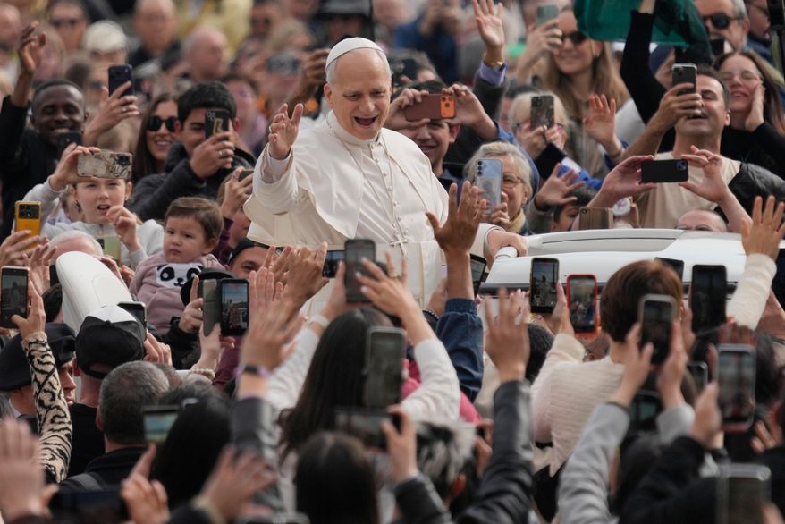 Pope Leo XIV waves as he arrives for his weekly general audience in St. Peter's Square at The Vatican, Wednesday, March 11, 2026. (AP Photo/Gregorio Borgia)