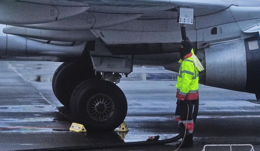 An airplane is refueled at Seattle-Tacoma International Airport in SeaTac, Wash., on Sunday, Nov. 23, 2025. (AP Photo/Lindsey Wasson, File)