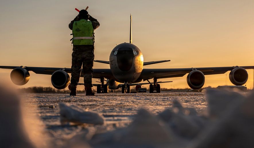 In this Jan. 28, 2026 photo, U.S. Air Force Master Sgt. Aaron Slupski, a crew chief with the 121st Maintenance Group, prepares to marshal a KC-135 Stratotanker at Rickenbacker Air National Guard Base, Columbus, Ohio. Ohio Gov. Mike DeWine said Friday that three of six crew members of an American KC-135 refueling plane were killed when it crashed in Iraq were from his state and had deployed with the Ohio Air National Guard's 121st Air Refueling Wing. (Ralph Branson, U.S. Air National Guard photo via AP)