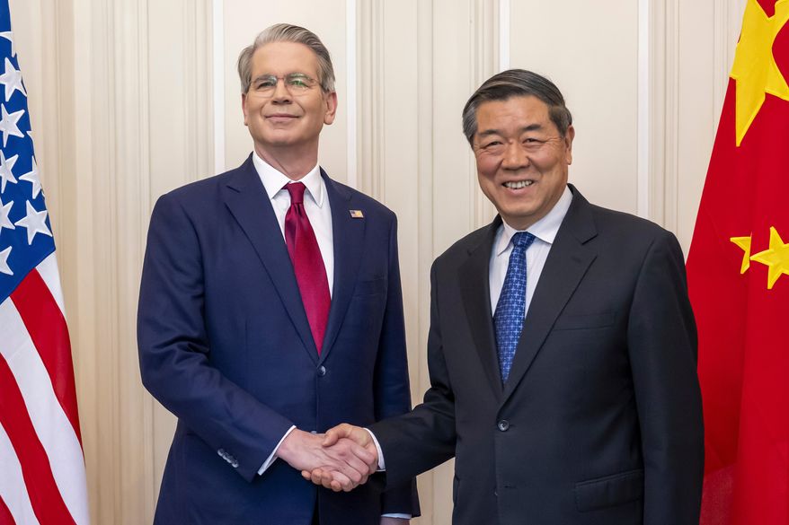 FILE - U.S. Secretary of the Treasury Scott Bessent, left, shakes hands with Chinese Vice Premier He Lifeng, right, during a bilateral meeting between the United States and China, in Geneva, Switzerland, on Saturday, May 10, 2025. (Martial Trezzini/Keystone via AP, File)