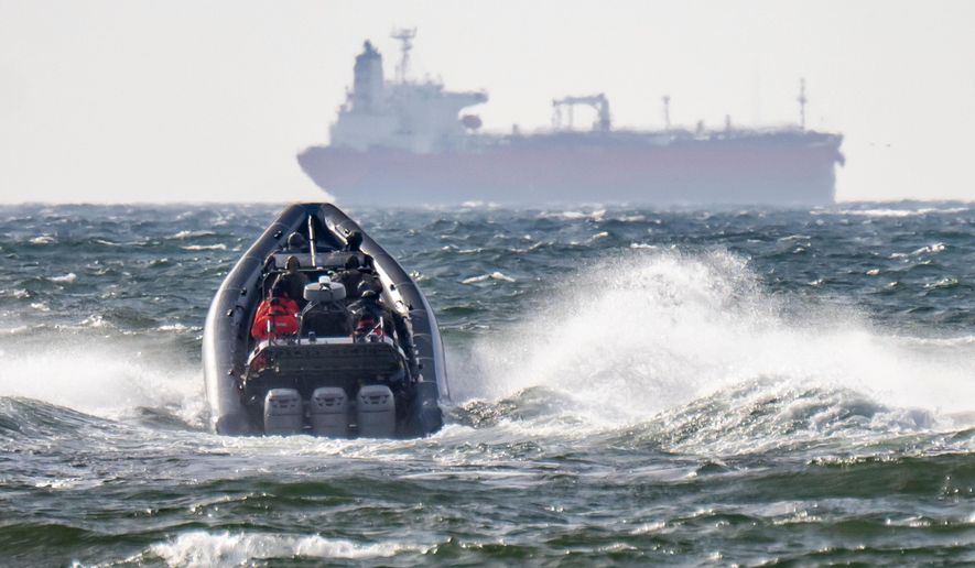 The Swedish Police National Task Force (NI) and the Coast Guard on their way to the already boarded tanker Sea Owl I, outside Trelleborg, Sweden, Friday, March 13, 2026. (Johan Nilsson/TT via AP)